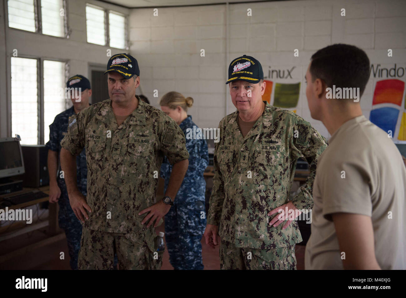 150904-N-KG407-175 COROCITO, Honduras (Sept. 4, 2015) Capt. Sam Hancock, left, Continuing Promise 2015 mission commander, and Rear Adm. George Ballance, Commander, U.S. Naval Forces Southern Command/ U.S. 4th Fleet, tour a medical site established at Centro de Educacion Basica Dr. Jesus Aquilar Paz in support of Continuing Promise 2015. Continuing Promise is a U.S. Southern Command-sponsored and U.S. Naval Forces Southern Command/U.S. 4th Fleet-conducted deployment to conduct civil-military operations including humanitarian-civil assistance, subject matter expert exchanges, medical, dental, ve Stock Photo