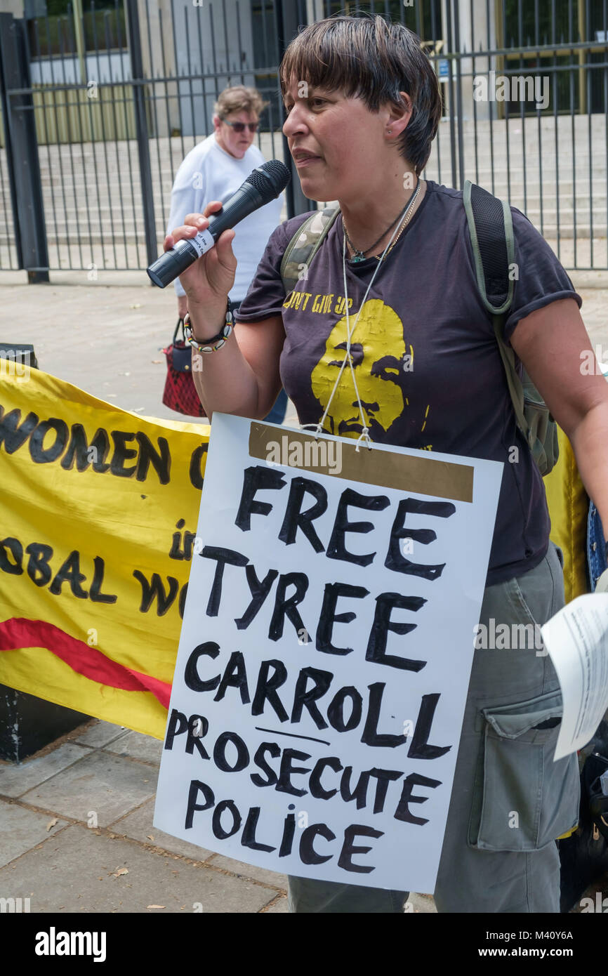 A speaker at the protest against the arrested and brutal beating by