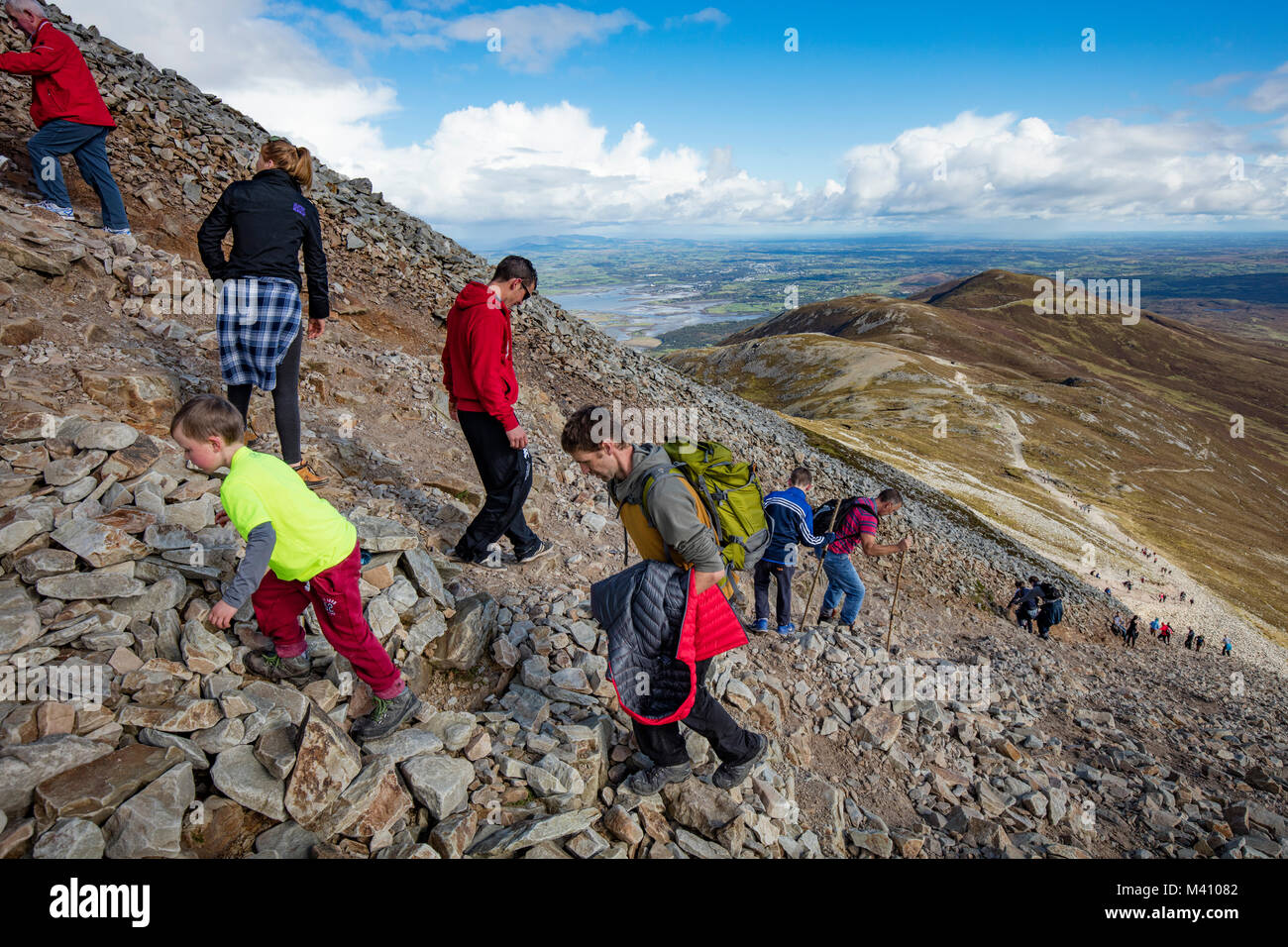 Hikers climbing Croagh Patrick, County Mayo, Ireland. Stock Photo