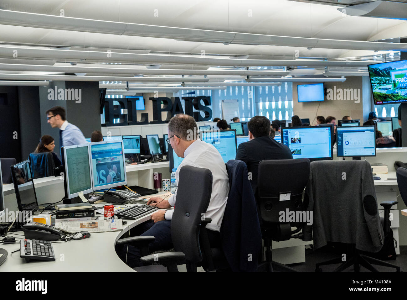 Journalists working in the main news-room of Spanish major daily  newspaper El Pais in Madrid. Stock Photo