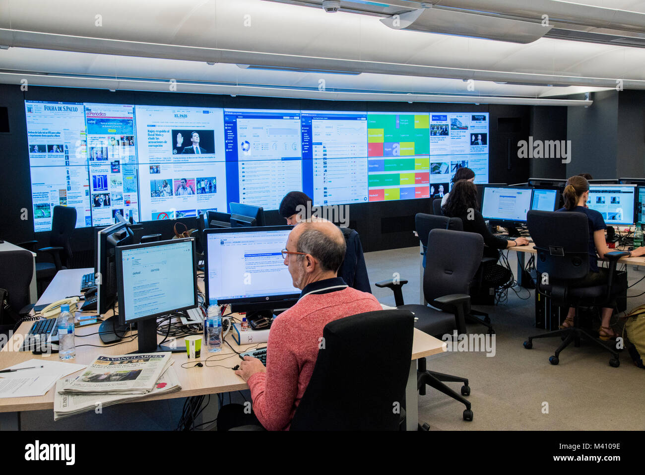 Journalists working in the main news-room of Spanish major daily  newspaper El Pais in Madrid. Stock Photo