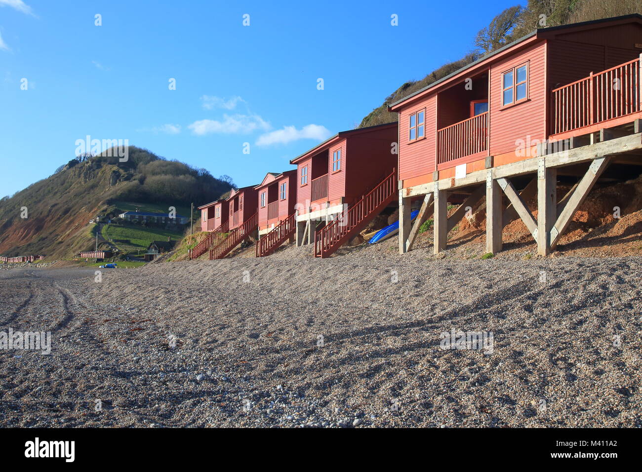 Beach huts on Bransombe pebble beach on the  Jurassic Coast Stock Photo