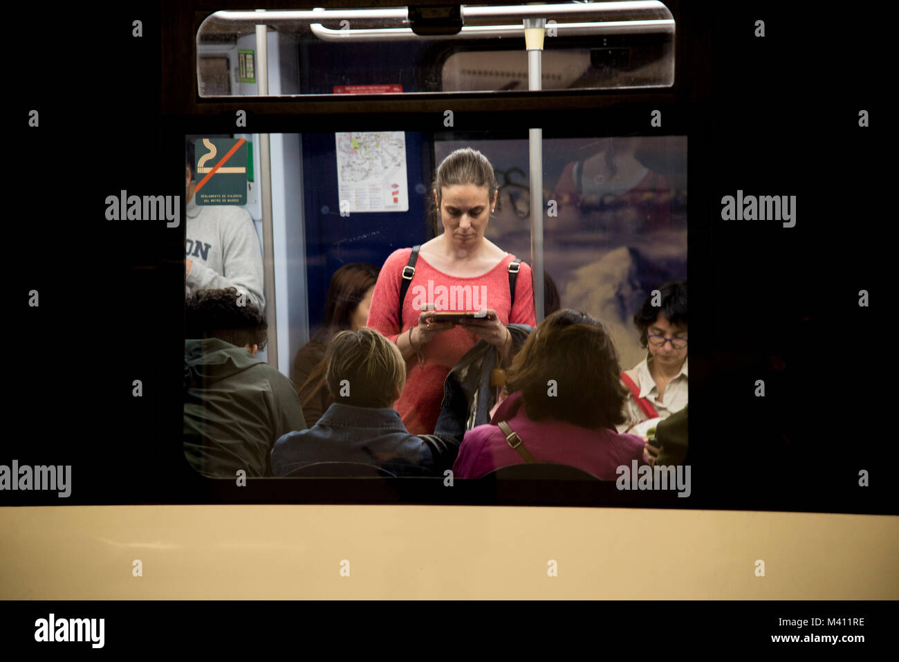 Passengers on an underground train in central MadridMadrid Stock Photo