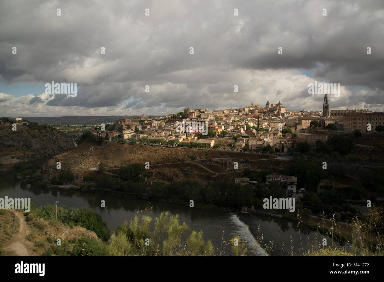 Panoramic view with dark clouds over former Spanich capital Toledo near Madrid in the Casilla - La Manch region Stock Photo