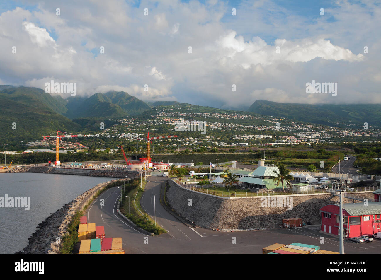 Seaport at foot of mountains. Zone Industrielle ZI, Reunion Stock Photo