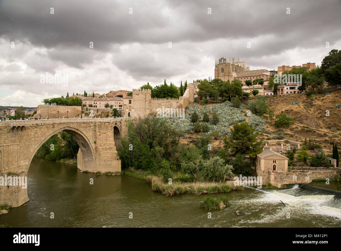 Old roman bridge Alcantara over the river Tagus at the former Spanich capital Toledo near Madrid in the Casilla - La Manch region Stock Photo