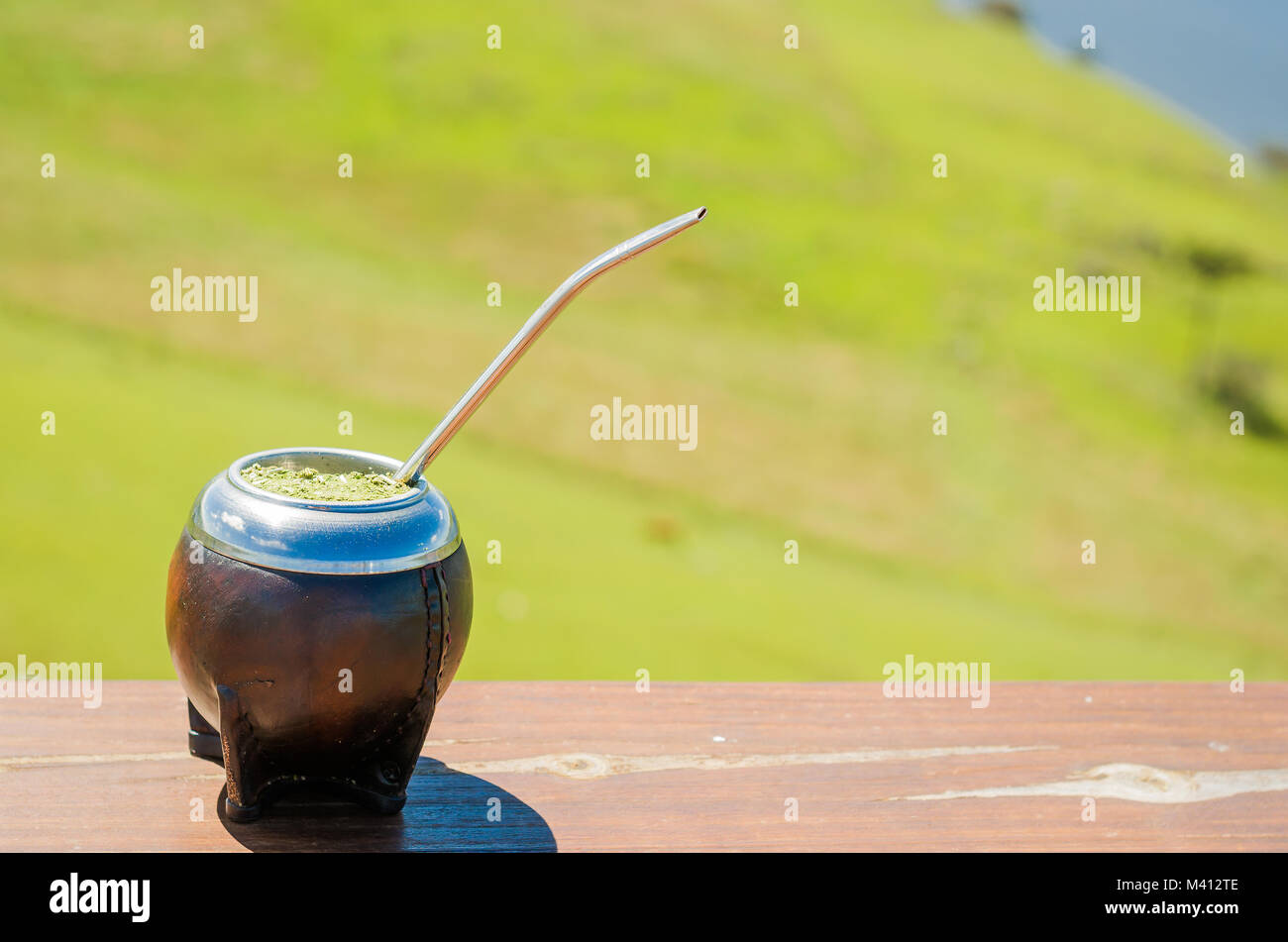 traditional mate, mate, with green field view Stock Photo - Alamy