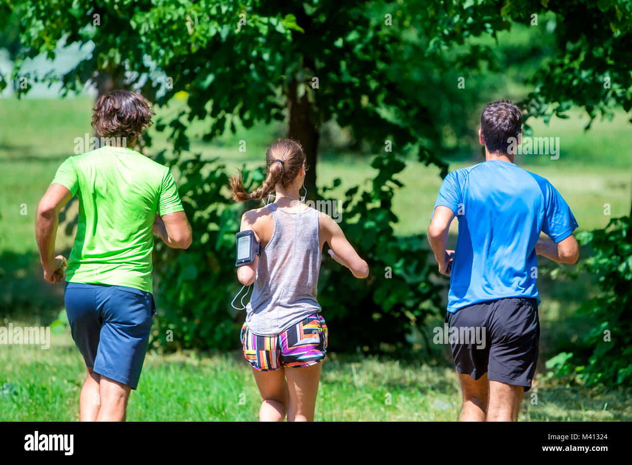 Two men running in park hi-res stock photography and images - Alamy