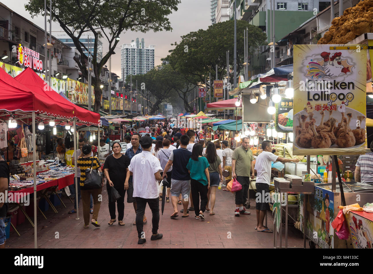 Kuala Lumpur, Malaysia - December 22 2017: Tourists and locals wander along Jalan Alor famous for its chinese food restaurant and street food stalls n Stock Photo