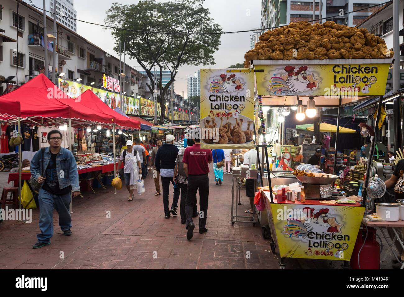 Kuala Lumpur, Malaysia - December 22 2017: Tourists and locals wander along Jalan Alor famous for its chinese food restaurant and street food stalls n Stock Photo