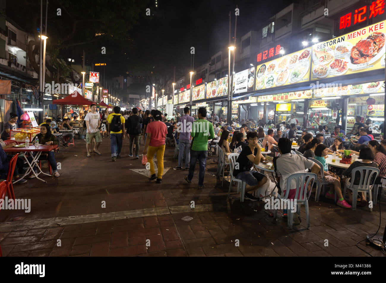 Kuala Lumpur, Malaysia - December 22 2017: Tourists and locals eating in Jalan Alor famous for its chinese food restaurant and street food stalls near Stock Photo