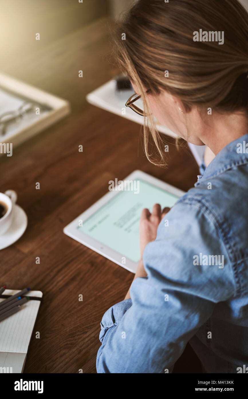 Woman sitting alone at table hi-res stock photography and images - Alamy