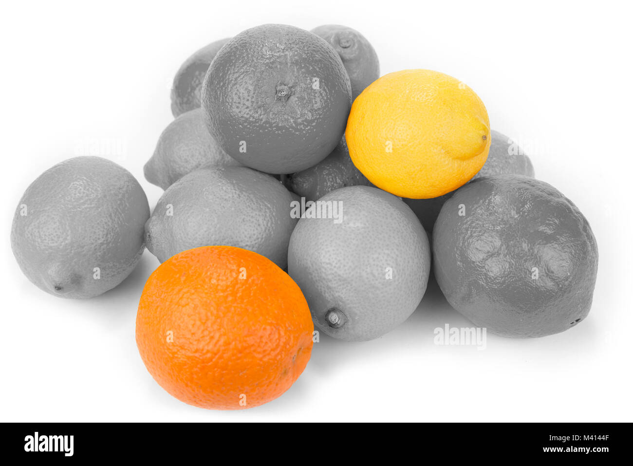 Black and white lemons and oranges friut with color one. Stock Photo