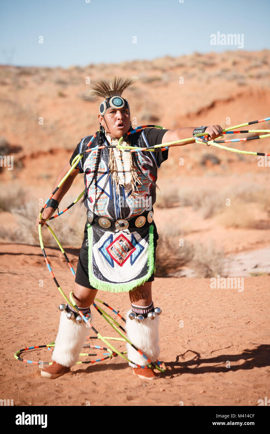 A Navajo Native American Man performs traditional hoop dance Stock Photo