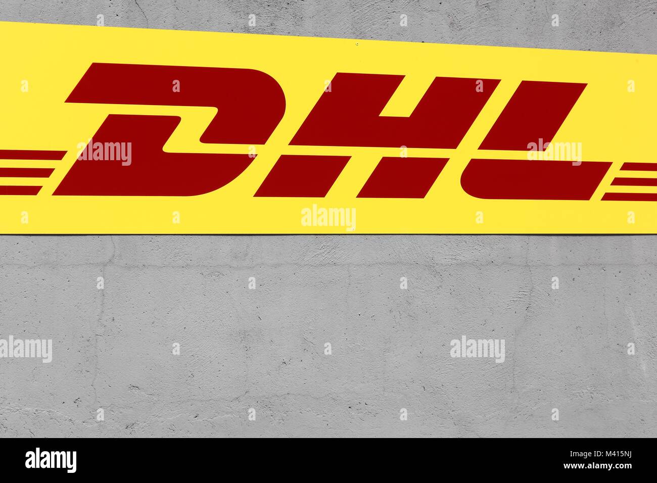 Sassenage, France - June 24, 2017: DHL logo on a facade. DHL Express is a division of the german logistics company Deutsche Post Stock Photo
