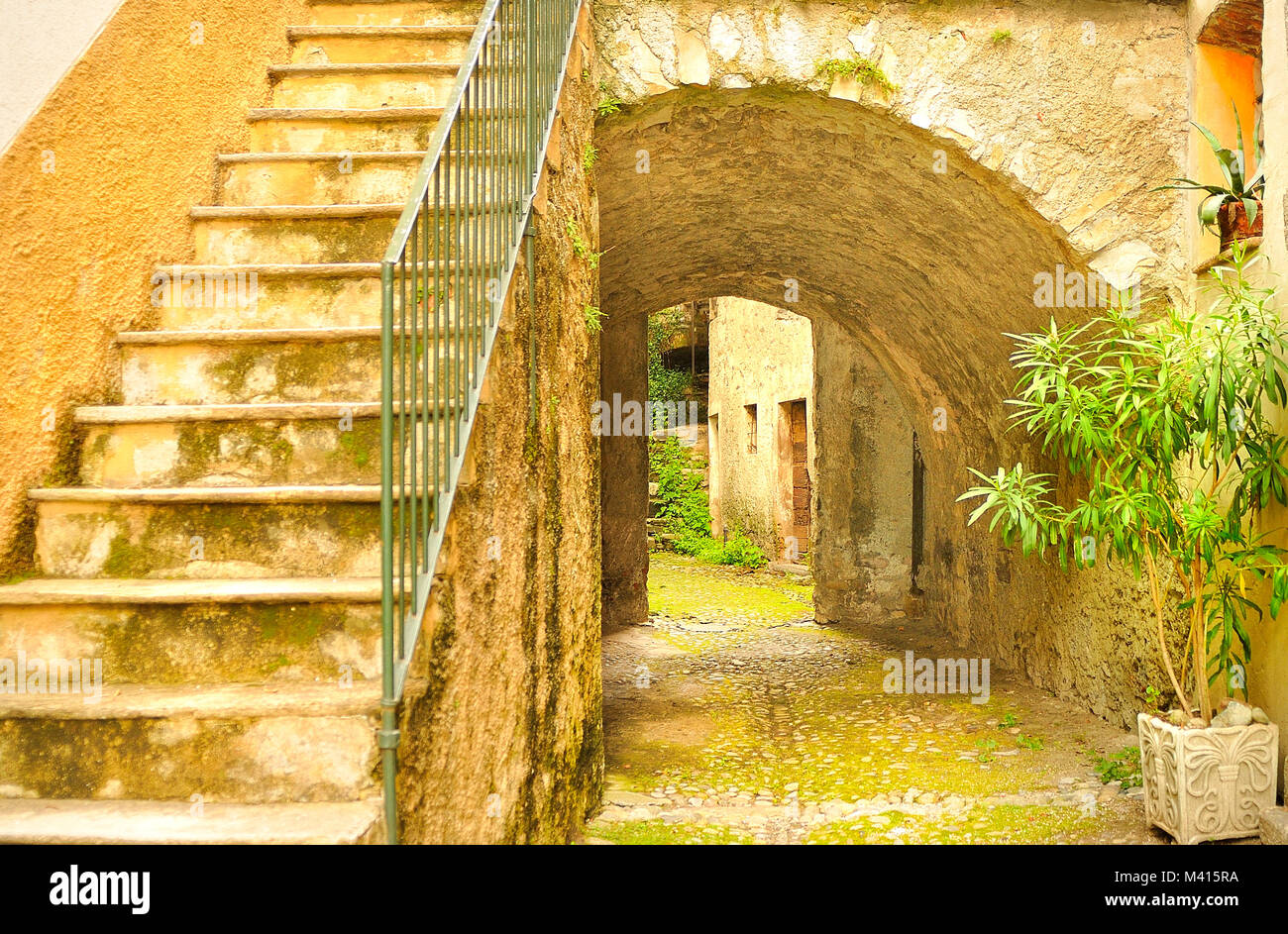 Old houses in cobbled streets in the village of Colonno, near Lake Como, italy Stock Photo