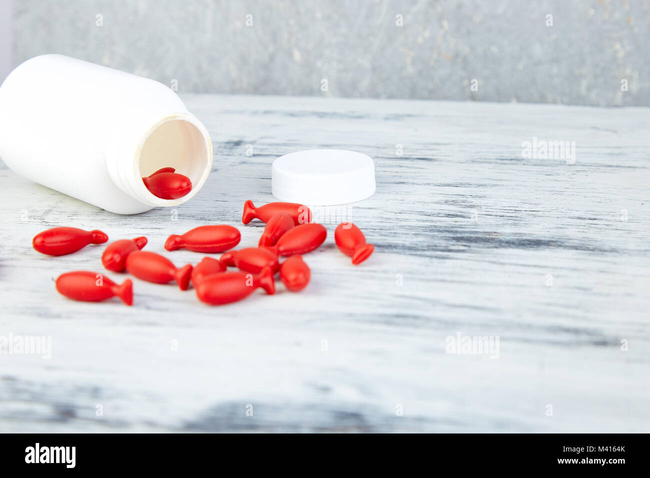 Download Omega 3 In Fish Shaped Red Capsules Of Fish Oil In Bottle On White Stock Photo Alamy PSD Mockup Templates