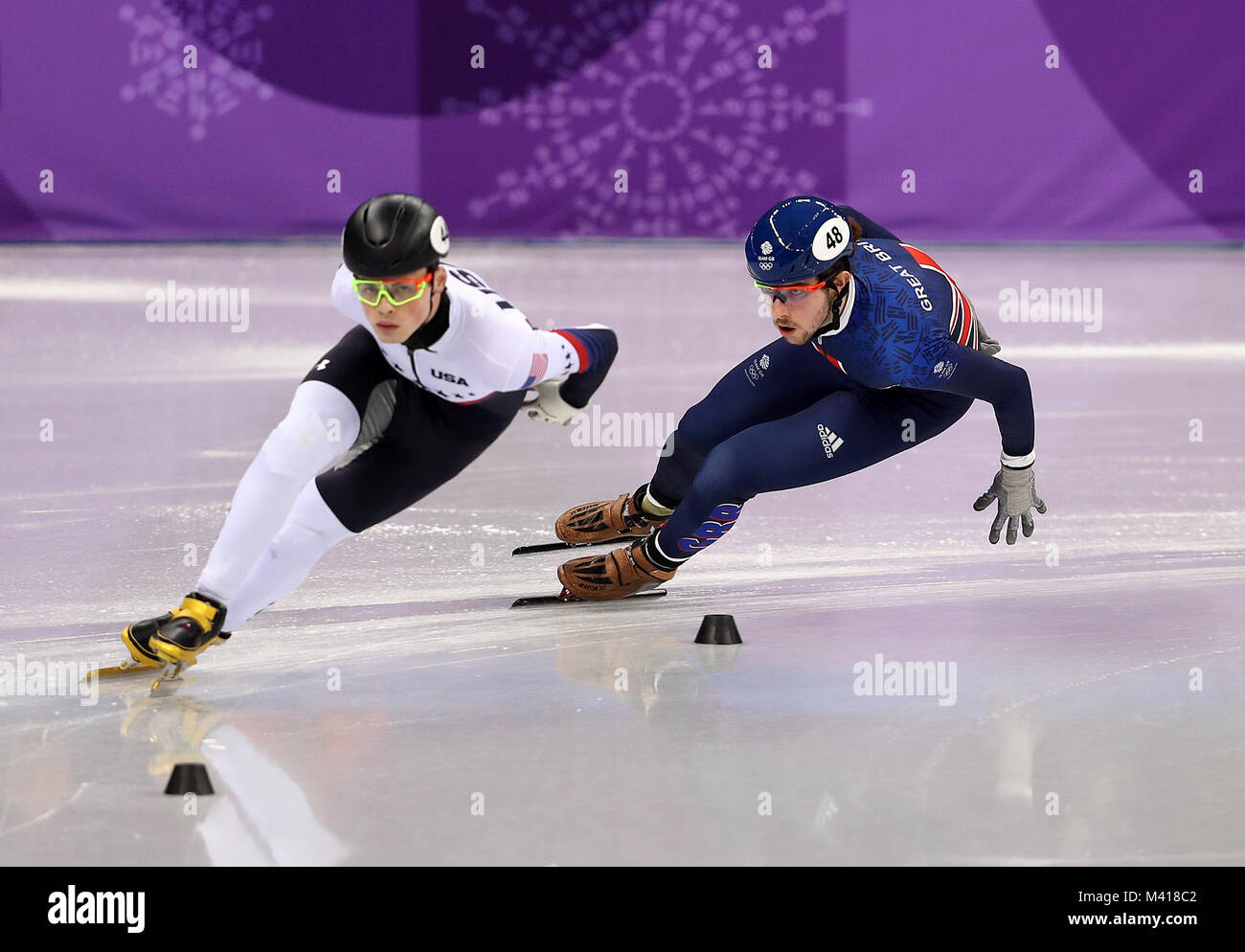 Great Britain's Farrell Treacy (right) on his way to finishing second in the Men's Short Track Speed Skating 1000m Heat 1 behind winner USA's John-Henry Krueger (left) at the Gangneung Oval during day four of the PyeongChang 2018 Winter Olympic Games in South Korea. PRESS ASSOCIATION Photo. Picture date: Tuesday February 13, 2018. See PA story OLYMPICS Short Track. Photo credit should read: David Davies/PA Wire. Stock Photo