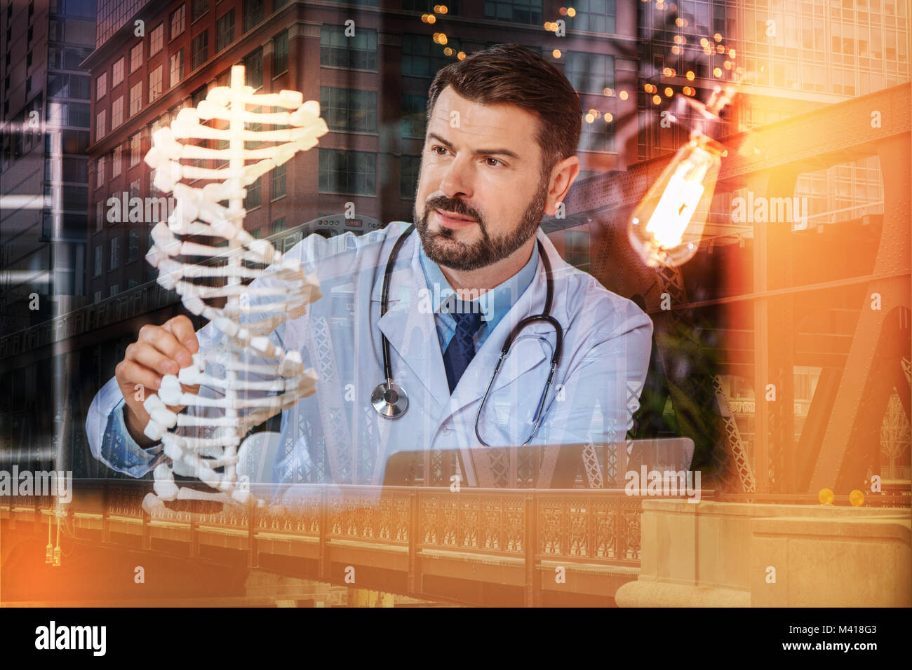 Smart Genetics Smart geneticist getting an idea while looking at the DNA model Stock ...