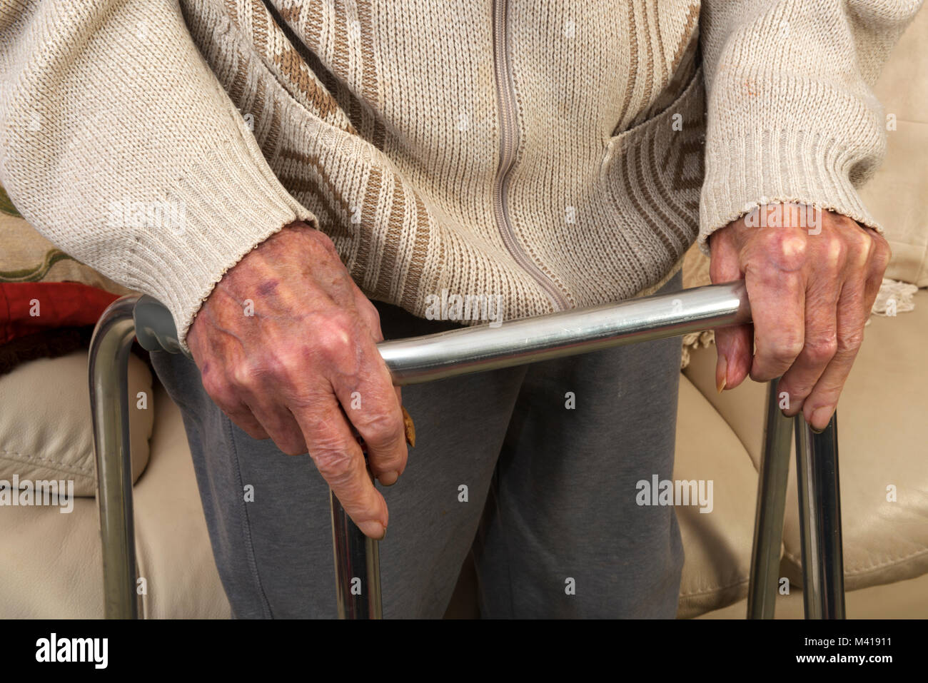 Elderly man using walking frame Stock Photo Alamy