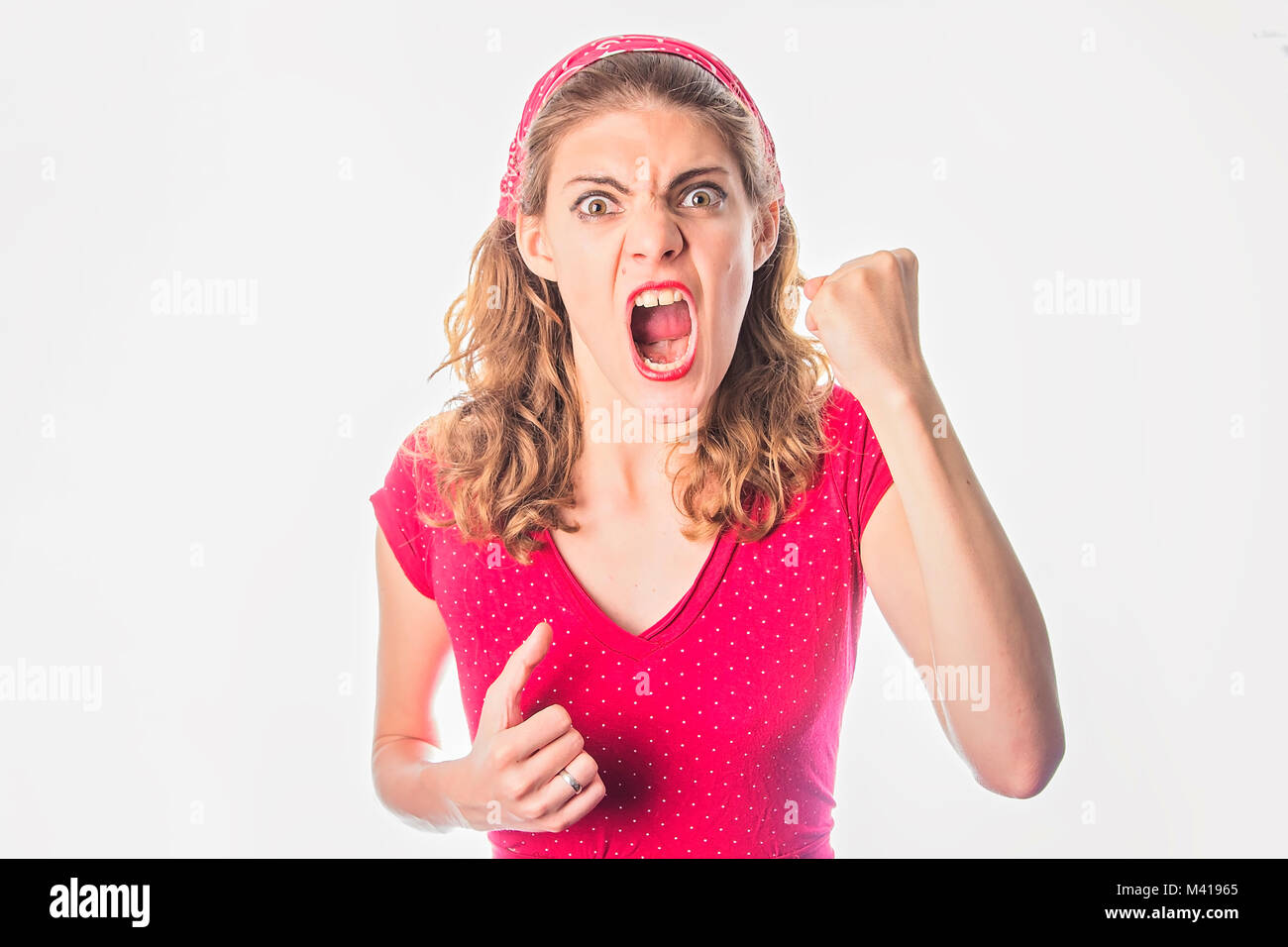 Angry young woman in red vintage dress Stock Photo