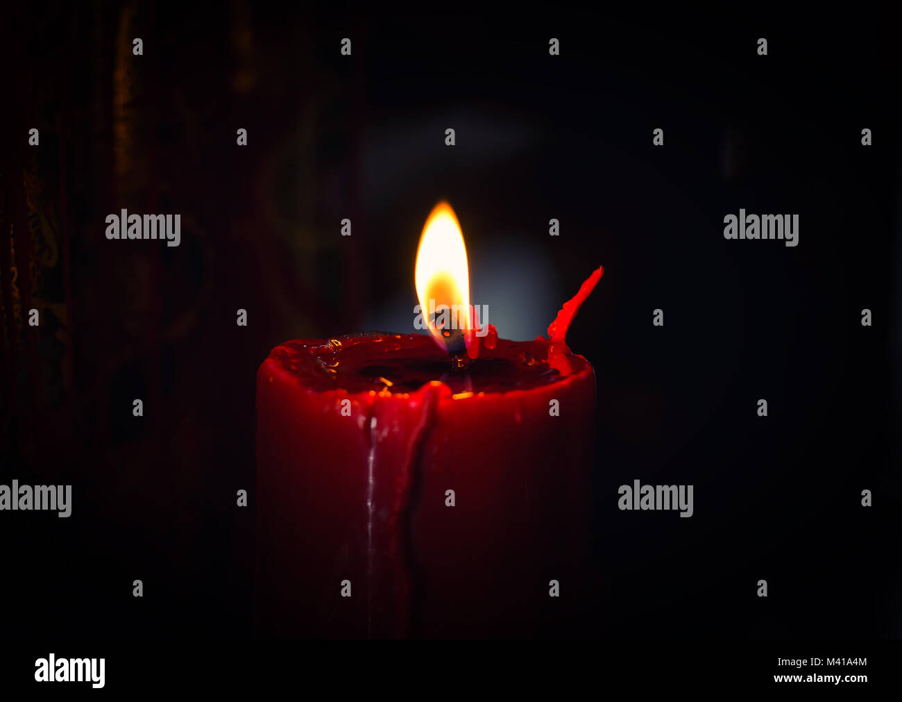 Candles burning on black background Stock Photo - Alamy