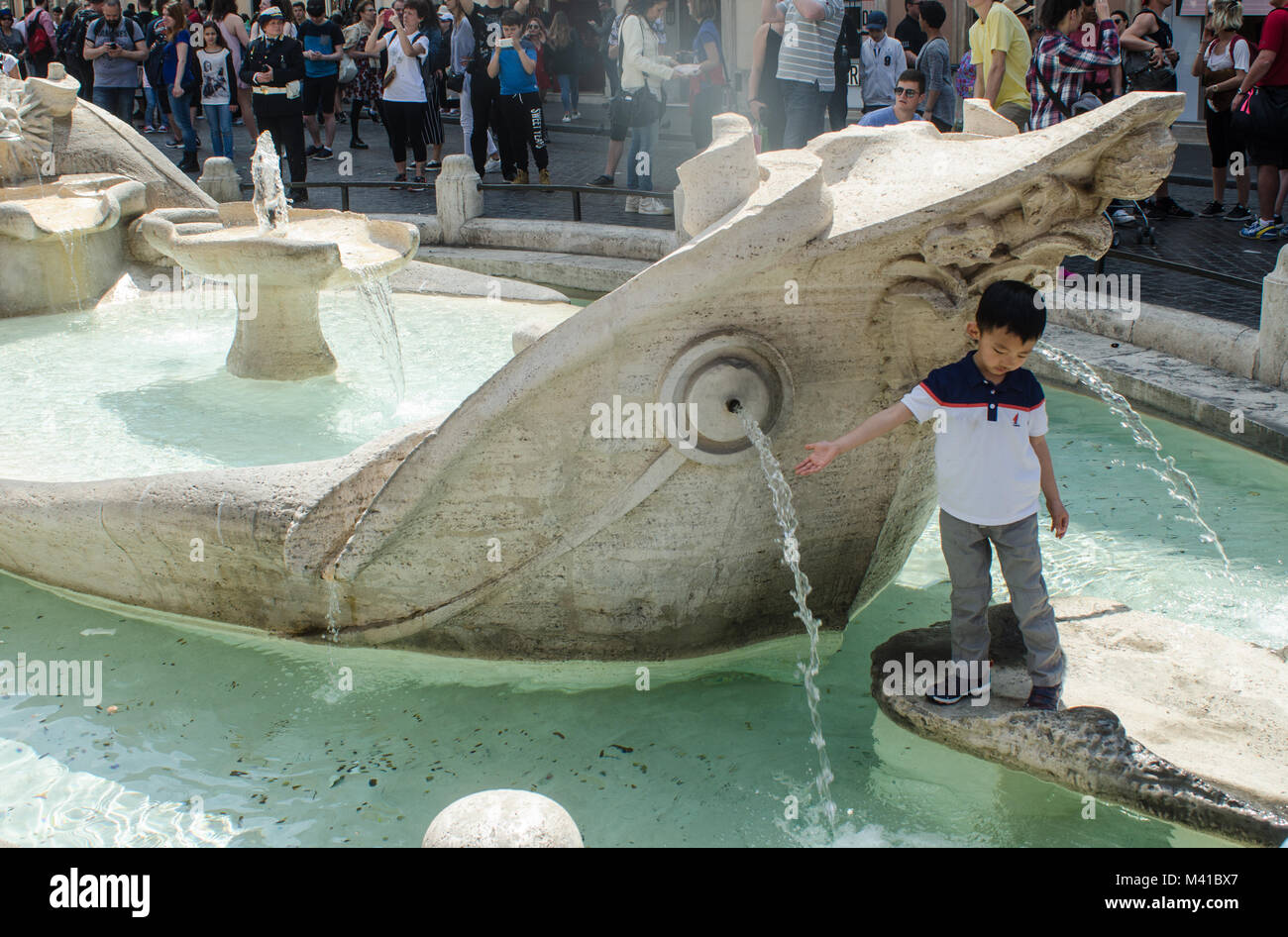 Child at the Fontana della Barcaccia Stock Photo