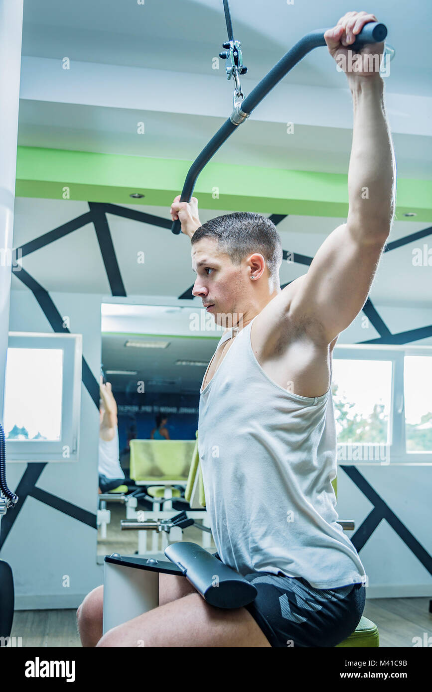 Shoulder pull down exercise Stock Photo - Alamy