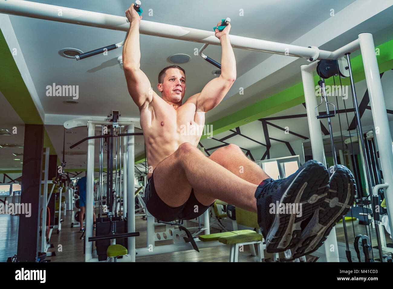 Fit woman preparing for the pull-ups on the horizontal bar Stock Photo -  Alamy