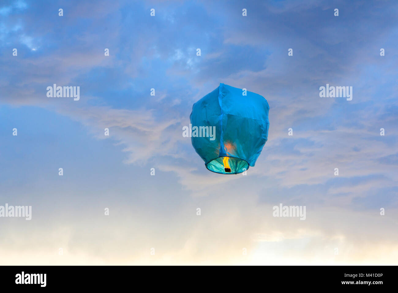 Bright blue paper Lantern flying in the sky Stock Photo Alamy