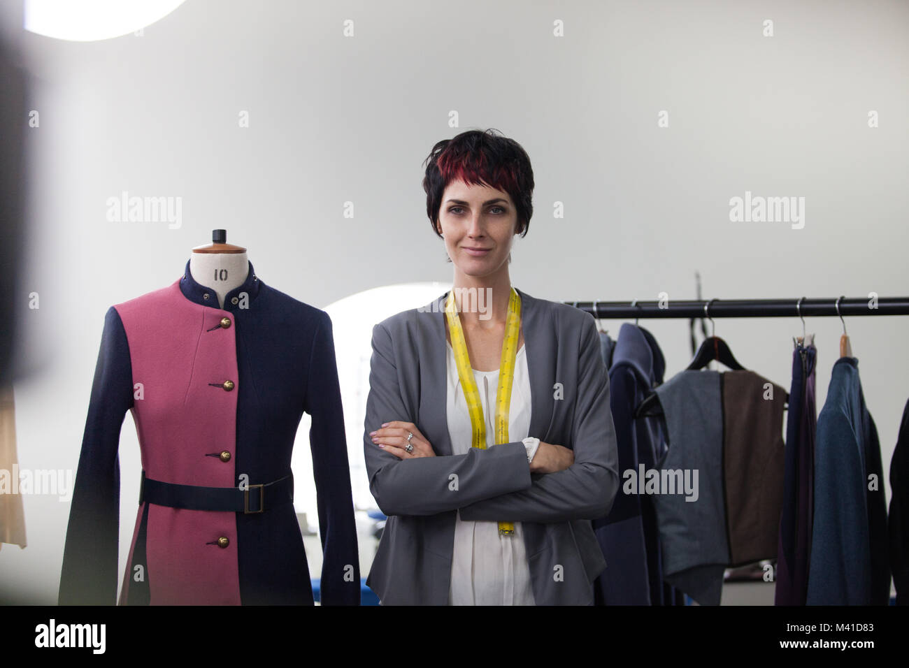 Fashion designer working on a garment Stock Photo