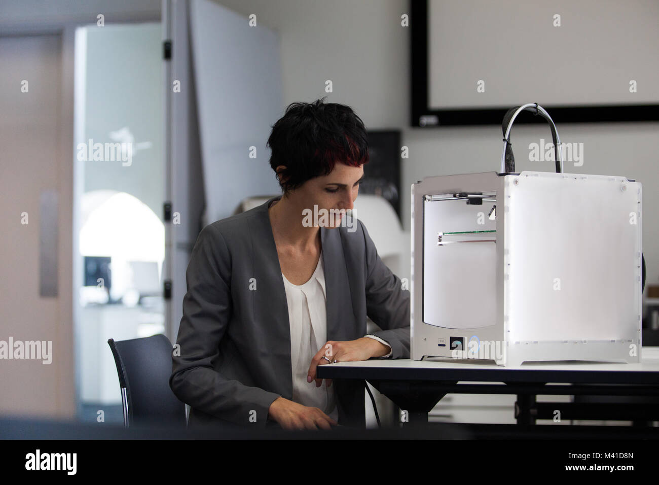 Designer with 3D printer Stock Photo