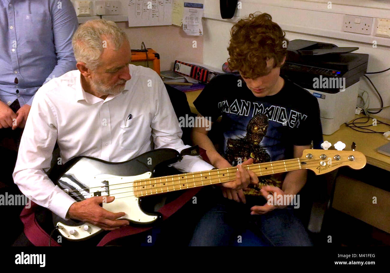 Labour leader Jeremy Corbyn tries a bass guitar at a community centre in Kilwinning, North Ayrshire, as part of campaigning to win back support in Scotland, as he rounded off a visit north of the Border. Stock Photo