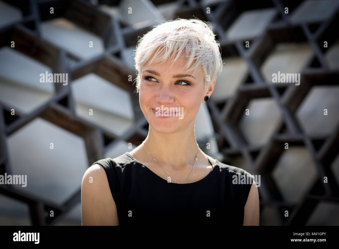 Portrait of woman in city Stock Photo