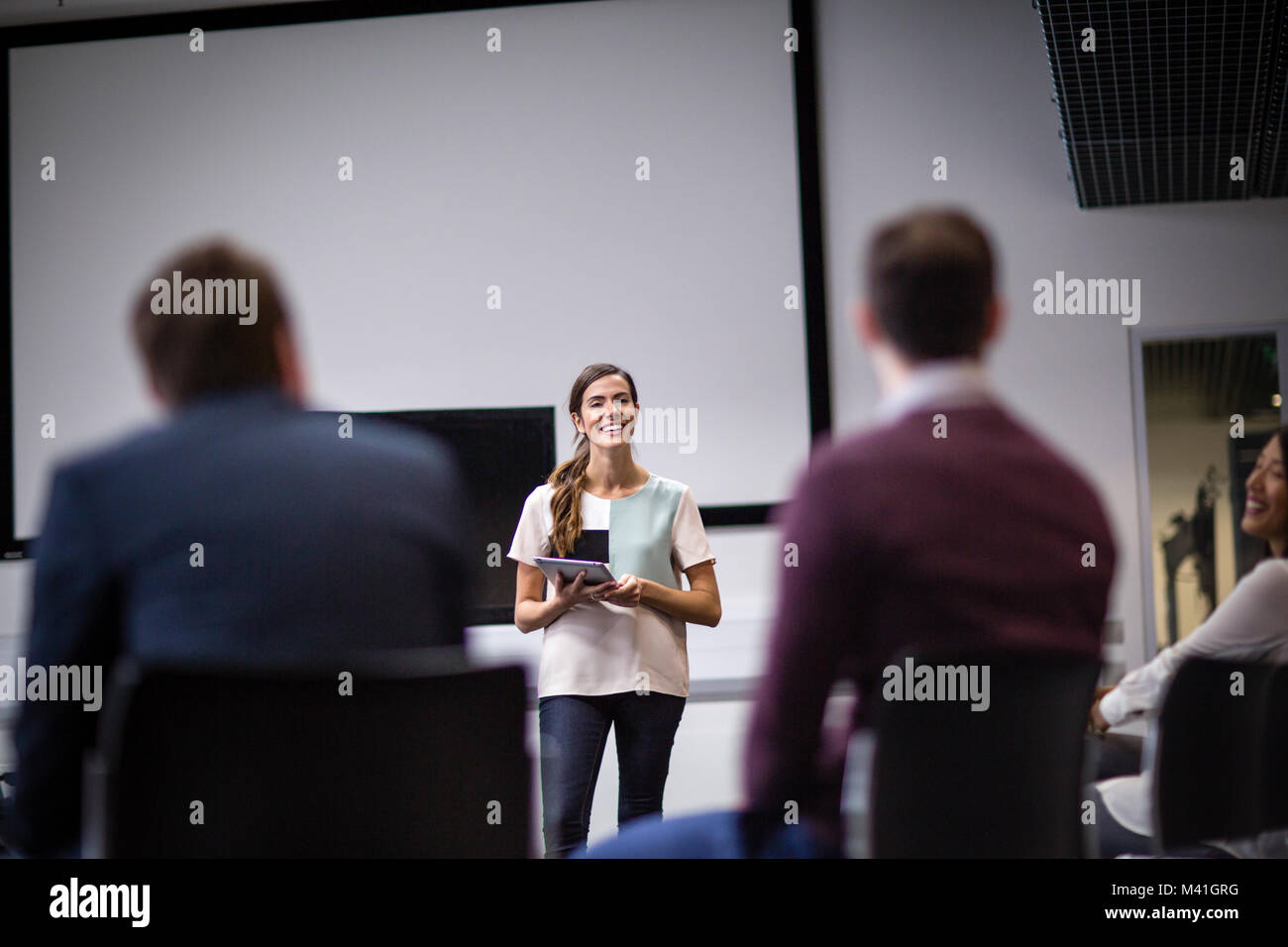 Female executive leading a  training conference Stock Photo