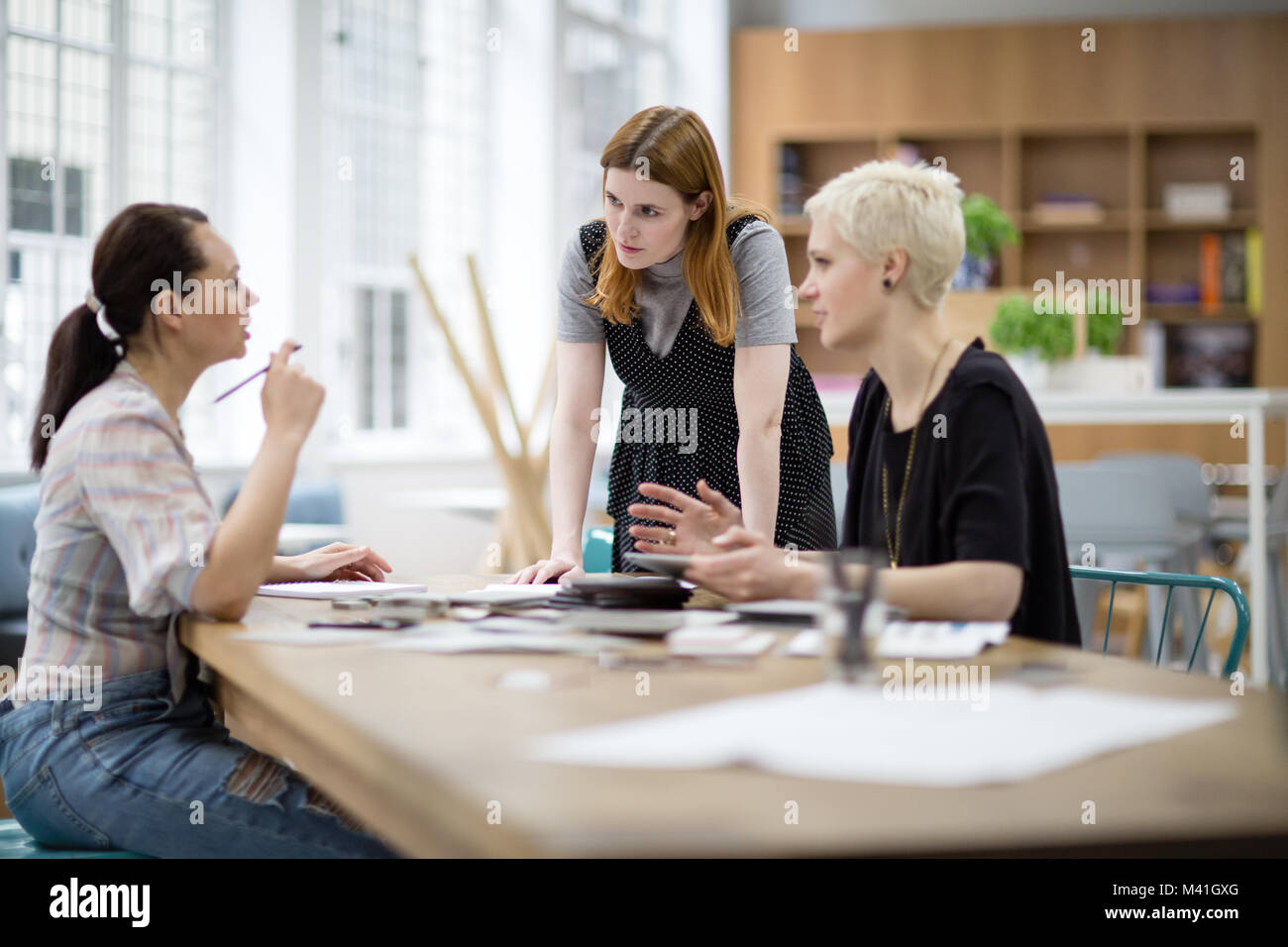 Female coworkers working on a project Stock Photo