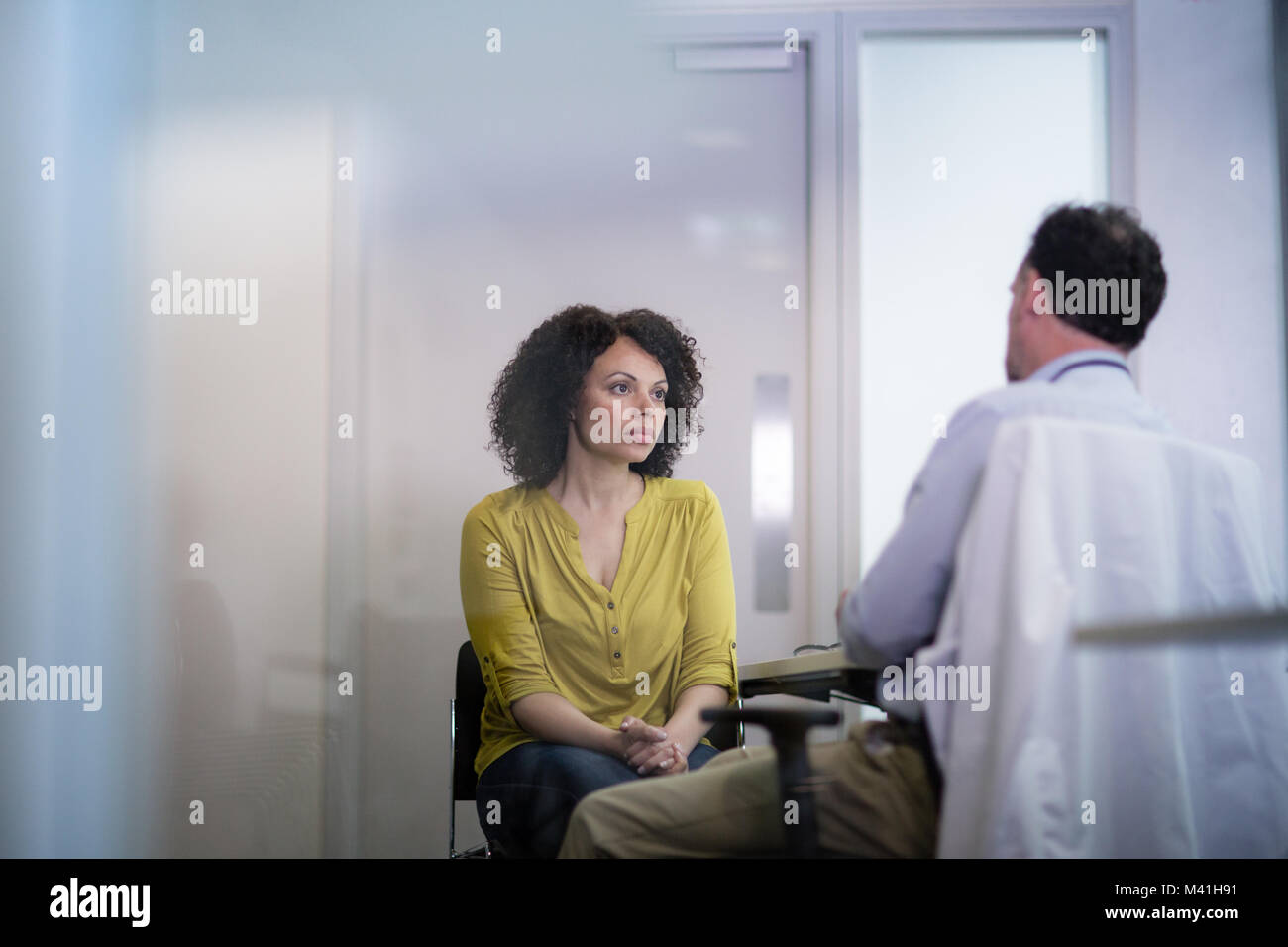 Patient listening to Medical Doctor explain treatment Stock Photo