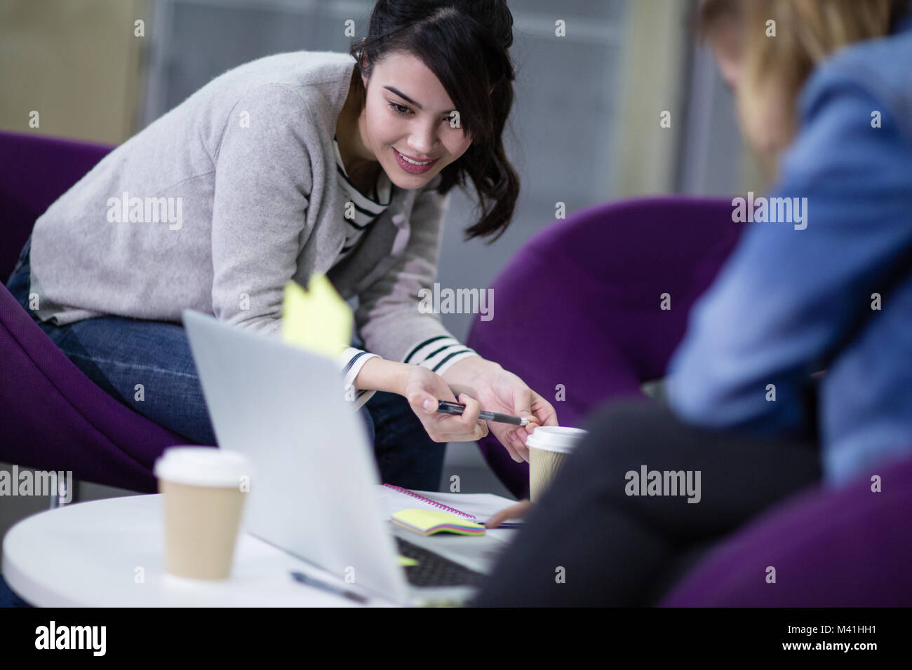 Female students working together Stock Photo