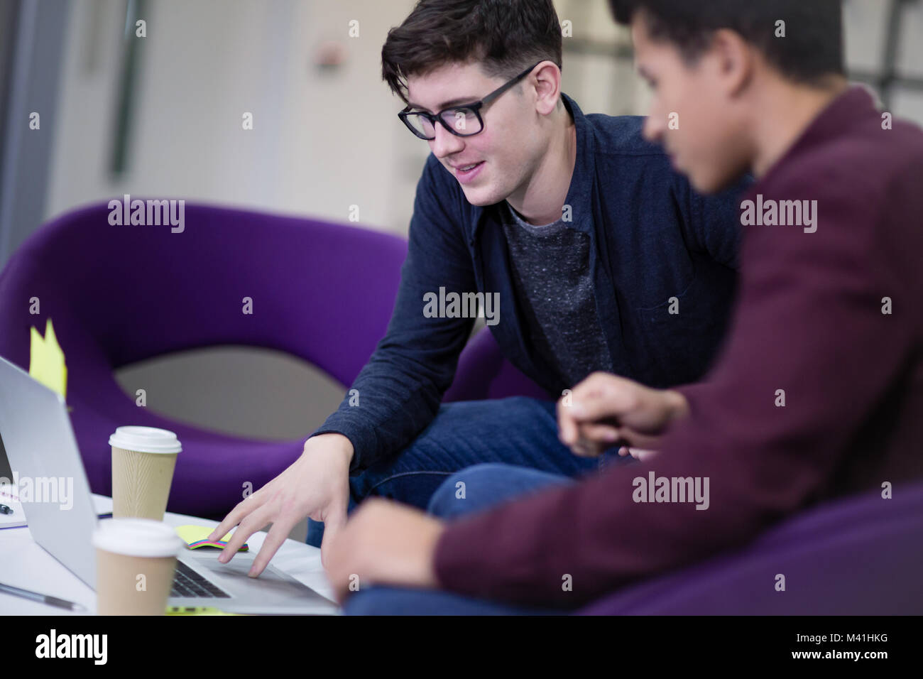 Male students working together Stock Photo