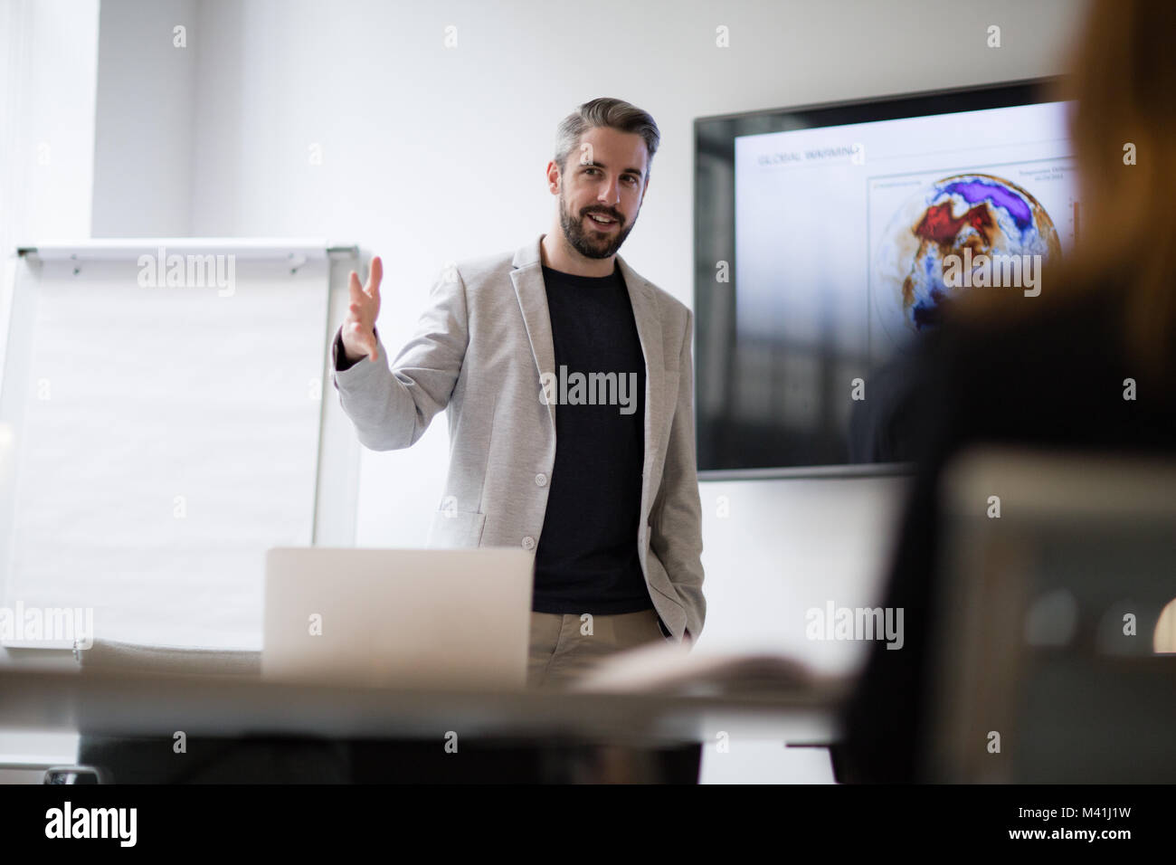 Male business executive giving a presentation Stock Photo