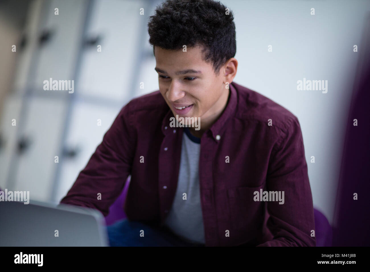Student working on a laptop at college Stock Photo
