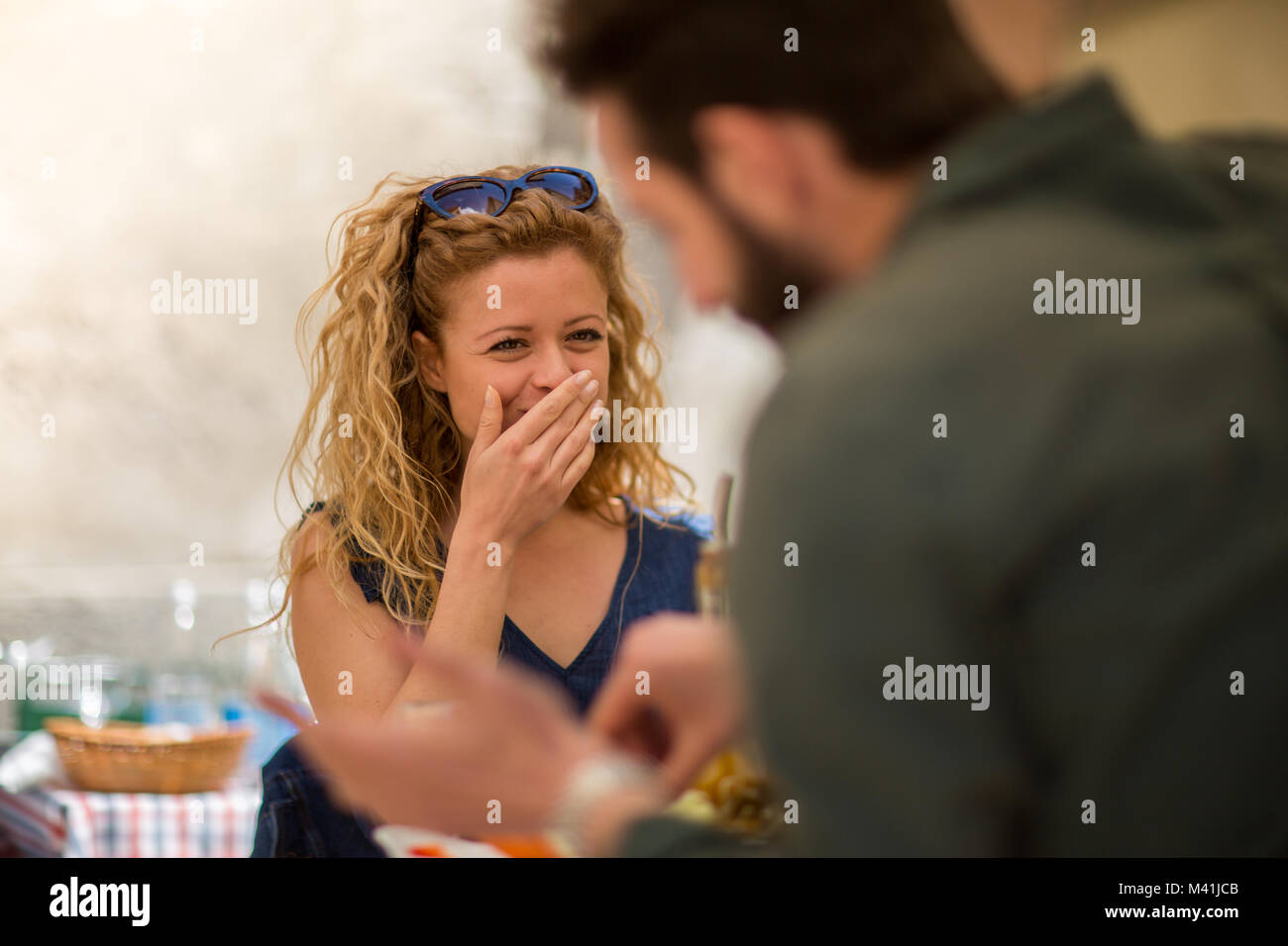 Young couple eating alfresco on vacation Stock Photo