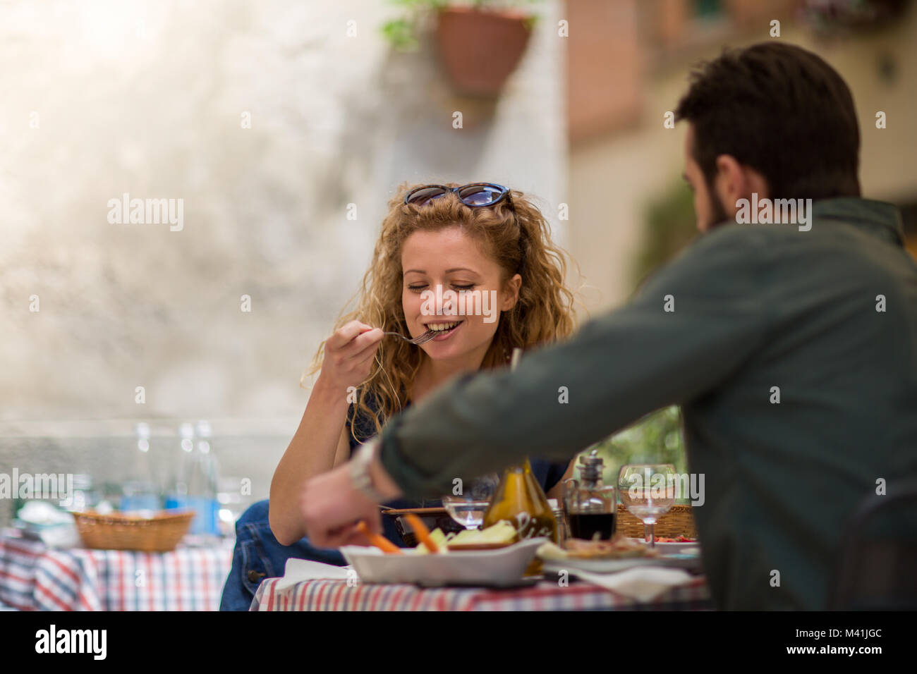 Young couple eating alfresco on vacation Stock Photo