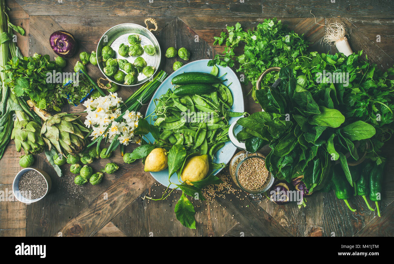 Spring healthy vegan food cooking ingredients, wooden background, top ...