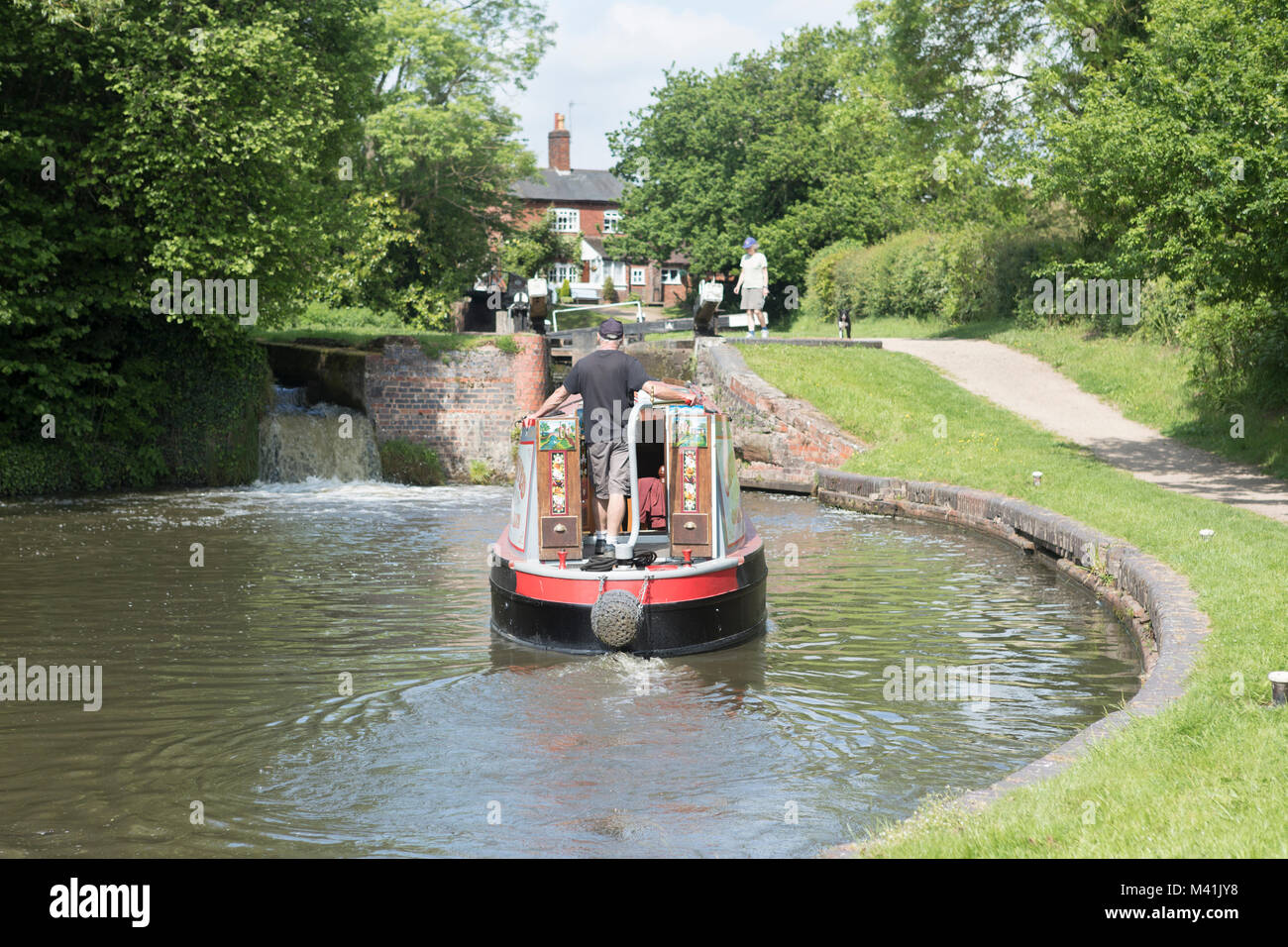 Narrow boat negotiating the Lapworth Lock flight, North Stratford Canal. Stock Photo