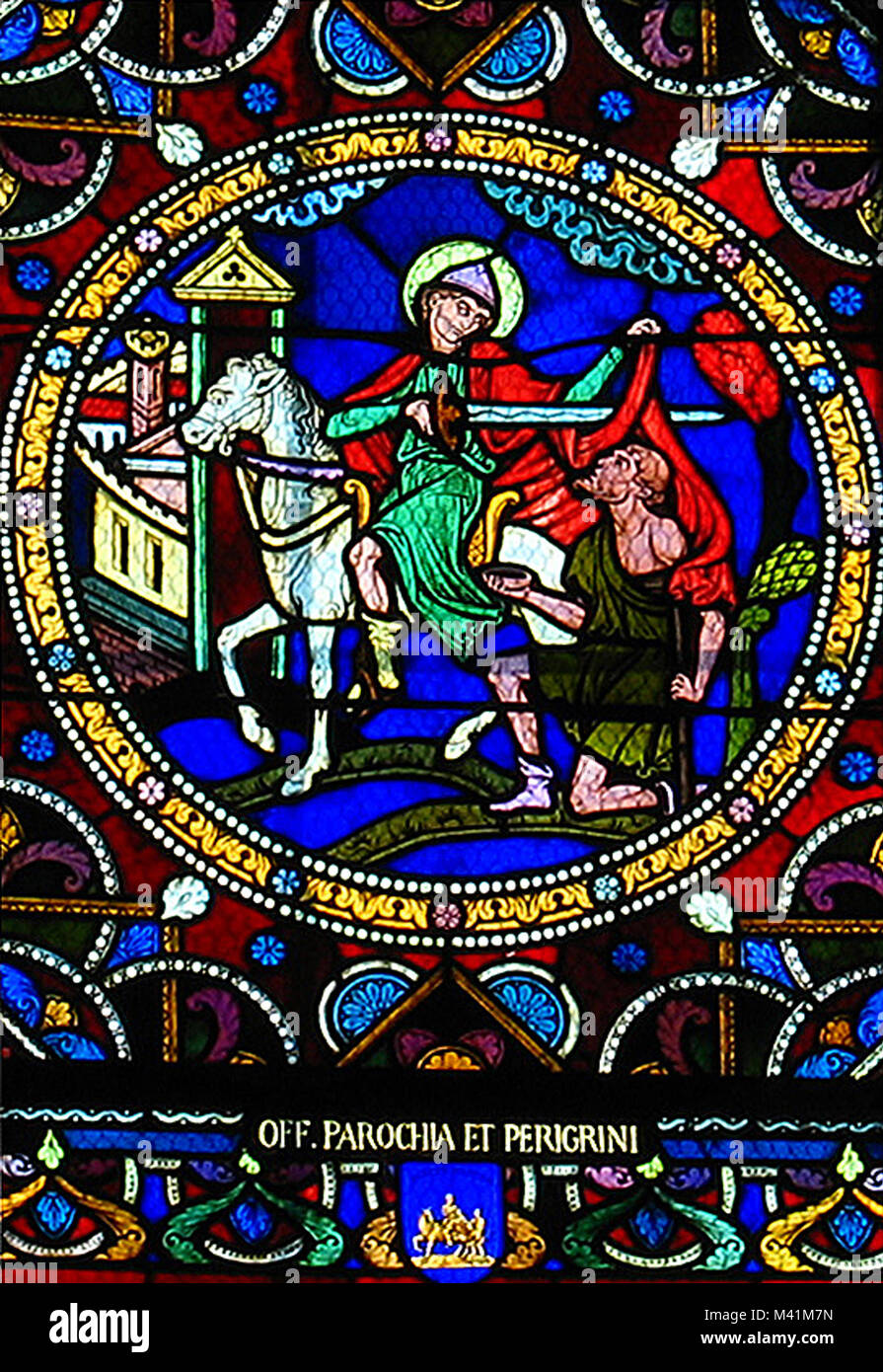 France, Indre et Loire, Loire valley listed as World Heritage by UNESCO, Candes Saint Martin, labelled Les Plus Beaux Villages de France (The most beautiful villages of France), collegiate church, stained glass representing the legend of Saint Martin cutting out his coat Stock Photo