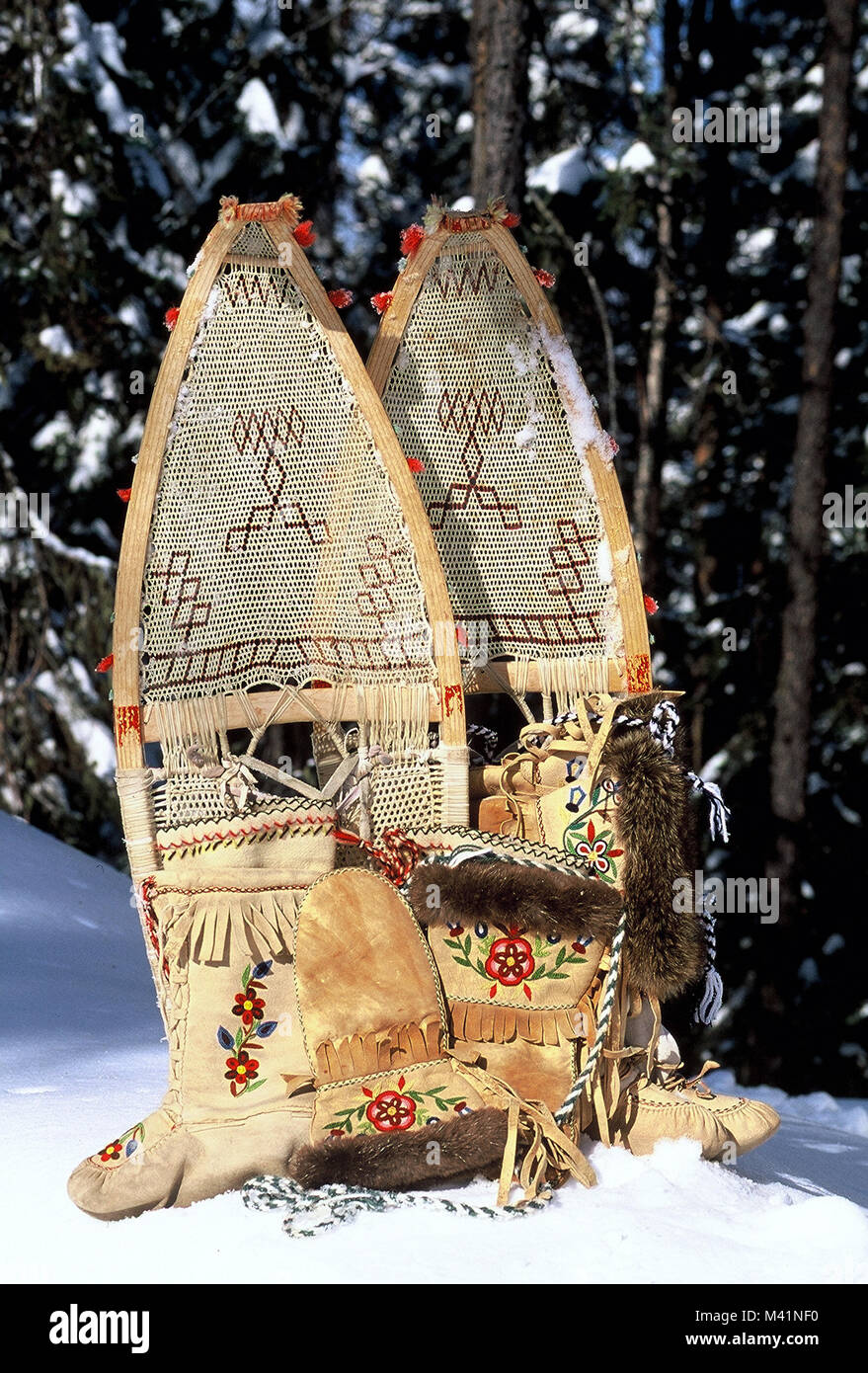 Canada, Quebec Province, Amerindian craft industry, traditional snowshoes made of wood and leather thin straps, mittens and boots made of deer skin Stock Photo
