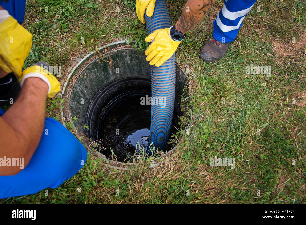 Emptying household septic tank. Cleaning and unblocking clogged drain