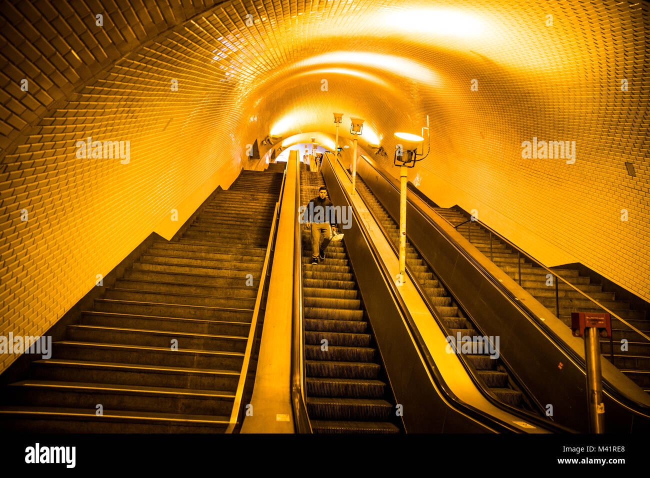People use the escalators in the Baixa-Chiado metro station in Lisbon, Portugal. Stock Photo