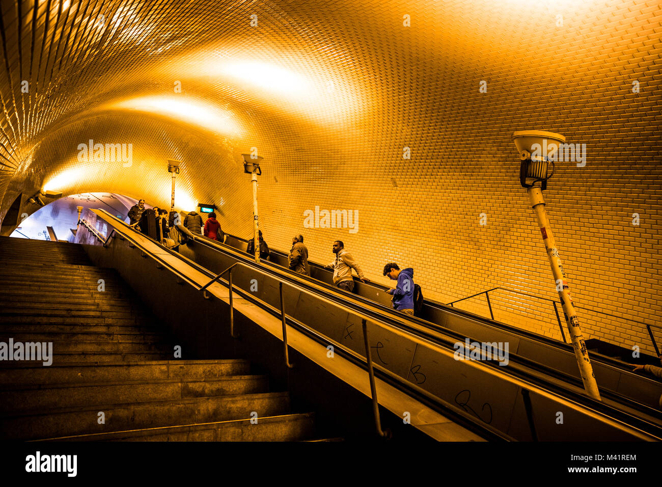 People use the escalators in the Baixa-Chiado metro station in Lisbon, Portugal. Stock Photo